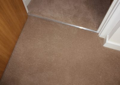 close up of a carpet in a hallway