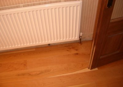 cherry wooden floor under radiator